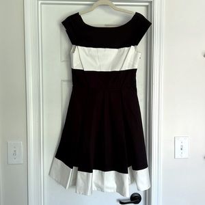 Kate Spade black and white cap sleeve dress with pleated skirt. Size 6